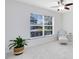 Bright bedroom with big window, natural light, and lounge chair at 1174 Snug Harbor Dr, Casselberry, FL 32707