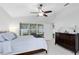 Bedroom features a large window, plush carpet, and ample natural light at 1174 Snug Harbor Dr, Casselberry, FL 32707
