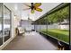 Screened patio with ceiling fans and comfortable seating at 1174 Snug Harbor Dr, Casselberry, FL 32707