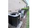Exterior view of modern AC units, ensuring efficient cooling for the home at 11962 Autumn Fern Ln, Orlando, FL 32827