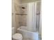 Bathroom featuring a shower/tub combo with a shower curtain at 11962 Autumn Fern Ln, Orlando, FL 32827