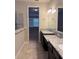 Bathroom features granite countertops, dual sinks, tile flooring, and glass-enclosed shower at 11962 Autumn Fern Ln, Orlando, FL 32827
