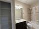 Bathroom featuring a shower/tub combo, granite countertop, and tiled floors at 11962 Autumn Fern Ln, Orlando, FL 32827