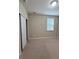 Bedroom featuring neutral carpet, a window, and a closet at 11962 Autumn Fern Ln, Orlando, FL 32827