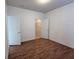 Bedroom with wood floors, and a unique textured wall at 11962 Autumn Fern Ln, Orlando, FL 32827