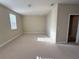 Spacious bonus room featuring neutral carpet, ample natural light, and a flexible layout at 11962 Autumn Fern Ln, Orlando, FL 32827
