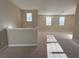 Upstairs bonus room with neutral carpet, lots of light, and multiple windows at 11962 Autumn Fern Ln, Orlando, FL 32827