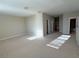 Large bonus room with plush carpeting, ample space for entertaining or recreation, and natural light at 11962 Autumn Fern Ln, Orlando, FL 32827