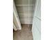 A closet with wire shelving and neutral carpet at 11962 Autumn Fern Ln, Orlando, FL 32827