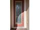 Close-up of an ornate front door featuring decorative glass and a secure lock with a key at 11962 Autumn Fern Ln, Orlando, FL 32827