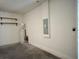 Clean garage featuring a water heater, electrical panel, and storage shelves at 11962 Autumn Fern Ln, Orlando, FL 32827