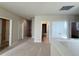 Hallway features neutral carpet, multiple doors and recessed lighting at 11962 Autumn Fern Ln, Orlando, FL 32827