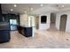 Spacious kitchen featuring dark cabinetry, granite countertops, and stainless steel appliances at 11962 Autumn Fern Ln, Orlando, FL 32827