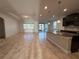 Spacious kitchen with large island, dark cabinets, and granite countertops at 11962 Autumn Fern Ln, Orlando, FL 32827