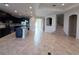 Open-concept living space featuring tile flooring, recessed lighting, and adjacent kitchen and office nook at 11962 Autumn Fern Ln, Orlando, FL 32827