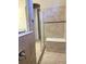 Shower with glass door and tiled bench seat at 11962 Autumn Fern Ln, Orlando, FL 32827
