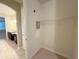 Hallway view to walk-in closet with a view to bathroom featuring granite countertops at 11962 Autumn Fern Ln, Orlando, FL 32827