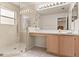 Bathroom features a glass shower, vanity with storage, and a large mirror at 126 Knights Hollow Dr, Apopka, FL 32712