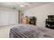 Bright bedroom featuring a cozy bed, large closet, and a desk workstation at 126 Knights Hollow Dr, Apopka, FL 32712