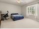 Inviting bedroom with a desk, chair, and window, ideal for a workspace or relaxation at 126 Knights Hollow Dr, Apopka, FL 32712
