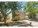 Charming two-story home with a well-maintained lawn, inviting entrance, and attached two-car garage at 126 Knights Hollow Dr, Apopka, FL 32712