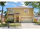 Two story home with a two car garage and covered front door and mailbox at 126 Knights Hollow Dr, Apopka, FL 32712