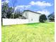 Spacious fenced backyard with lush green lawn, perfect for outdoor activities at 1309 Harms Way, Port Orange, FL 32129