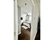 Bedroom features hardwood floors, ceiling fan, large bed, and neutral décor at 1309 Harms Way, Port Orange, FL 32129