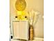 Tastefully decorated cabinet with lamps, succulents and a vase of dried Pampas Grass at 1309 Harms Way, Port Orange, FL 32129
