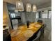 Dining room featuring wood table, chairs, bamboo light fixture, and sliding door at 1309 Harms Way, Port Orange, FL 32129