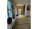 Inviting entryway featuring hardwood floors and white accents at 1309 Harms Way, Port Orange, FL 32129