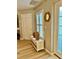 Bright foyer features a white storage bench with decorative details, and views into the entryway at 1309 Harms Way, Port Orange, FL 32129