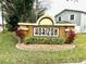 Welcoming 'Horizon' neighborhood sign surrounded by vibrant greenery and flowers at 1309 Harms Way, Port Orange, FL 32129