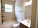 Bathroom featuring a shower/tub combo, new vanity and tile flooring at 13157 Sw 35Th Cir, Ocala, FL 34473