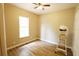 Bright bedroom with hardwood floors and a large window at 13157 Sw 35Th Cir, Ocala, FL 34473