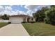 Charming single-story home with a two-car garage and well-maintained landscaping at 13157 Sw 35Th Cir, Ocala, FL 34473