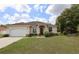 Charming single-story home with a two-car garage and well-maintained landscaping at 13157 Sw 35Th Cir, Ocala, FL 34473