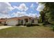 Charming single-story home with a two-car garage and well-maintained landscaping at 13157 Sw 35Th Cir, Ocala, FL 34473