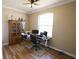 Functional office with ample natural light, modern decor, and wood-look flooring at 13157 Sw 35Th Cir, Ocala, FL 34473