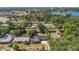 Aerial view of the property nestled among lush trees and showcasing its proximity to the city and lake at 1326 W Concord St, Orlando, FL 32805