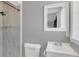 A modern bathroom featuring a shower, toilet, and vanity with a sleek design at 1326 W Concord St, Orlando, FL 32805