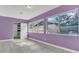 Bedroom featuring tile floors, fresh paint, and ample natural light from multiple windows at 1326 W Concord St, Orlando, FL 32805