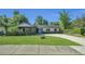 Charming single-story home with a well-manicured lawn, covered carport, and inviting curb appeal at 1326 W Concord St, Orlando, FL 32805