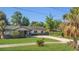 Inviting single-story home with a well-maintained lawn, mature trees, and a classic design at 1326 W Concord St, Orlando, FL 32805