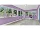 Bright sunroom featuring tile floors and large windows offering abundant natural light and outdoor views at 1326 W Concord St, Orlando, FL 32805