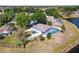 Aerial view of property, screened in pool, fenced in backyard, and lake at 134 Foggy Creek Ct, Davenport, FL 33837