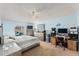 Bright, spacious bedroom featuring light blue walls and a view of the backyard at 134 Foggy Creek Ct, Davenport, FL 33837