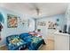 Playful bedroom with twin beds, cartoon decor, and plenty of space at 134 Foggy Creek Ct, Davenport, FL 33837