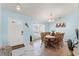 Inviting dining room with wood table set, tile flooring, and plenty of natural light at 134 Foggy Creek Ct, Davenport, FL 33837