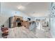 Open concept kitchen with stainless steel appliances, granite countertops, and an island with seating at 134 Foggy Creek Ct, Davenport, FL 33837